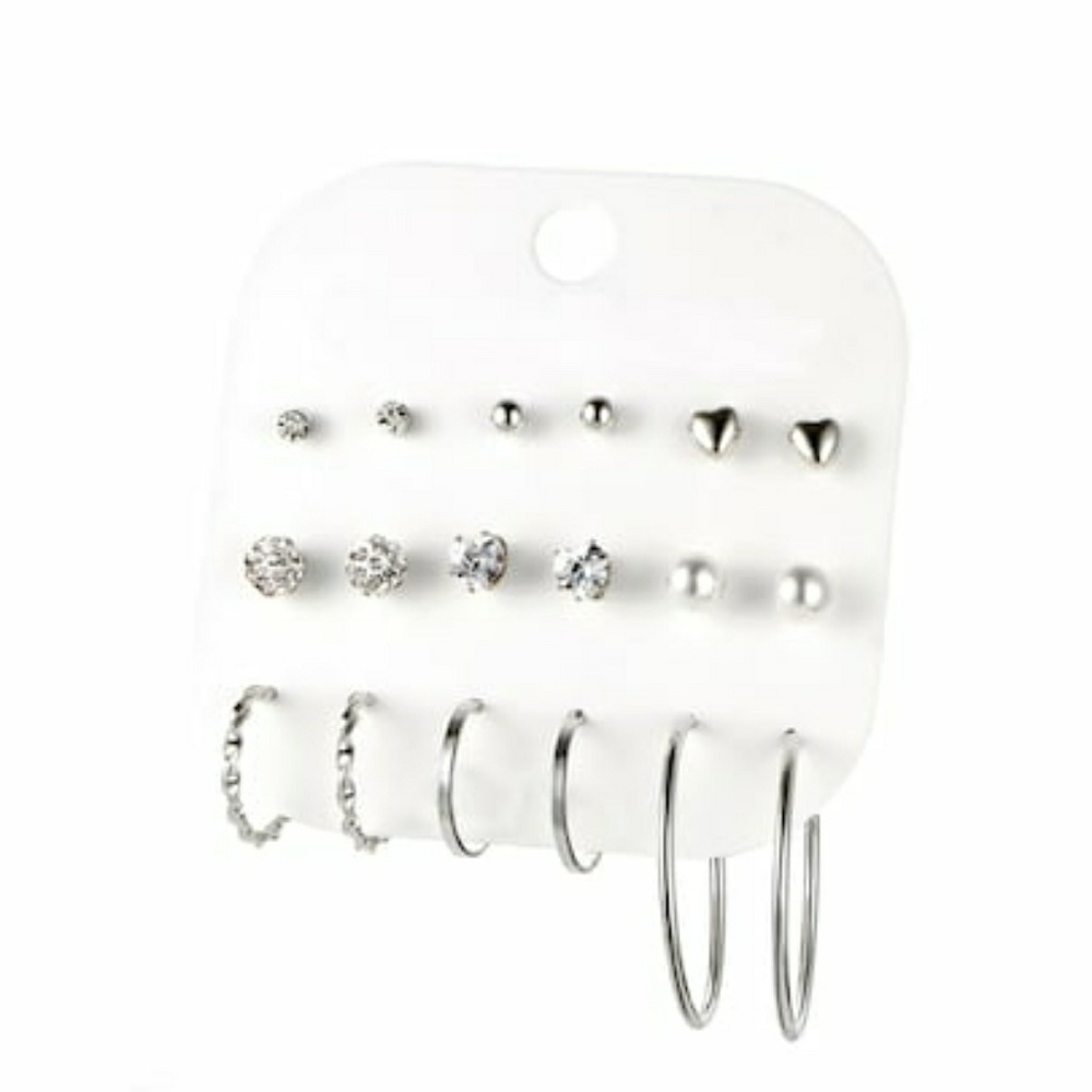 9 Pairs of Silver Earrings